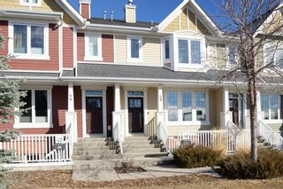 Photo 1: 48 Mike Ralph Way SW in Calgary: Garrison Green Row/Townhouse for sale : MLS®# A1198293