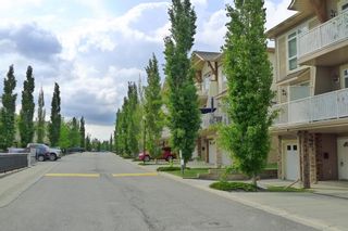 Photo 1: 4 172 Rockyledge View NW in Calgary: Rocky Ridge Row/Townhouse for sale : MLS®# A1246080
