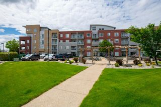 Photo 1: 1415 604 East Lake Boulevard NE: Airdrie Apartment for sale : MLS®# A1229561