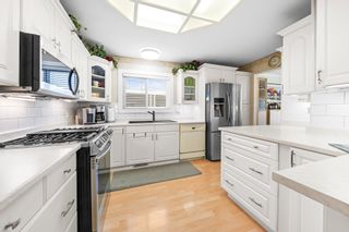 Photo 1: 5 145 KING EDWARD Street in Coquitlam: Maillardville Manufactured Home for sale in "MILL CREEK VILLAGE" : MLS®# R2829274