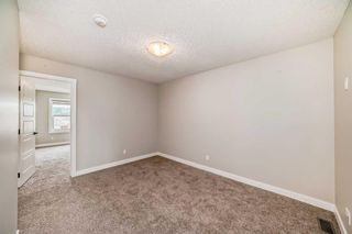 Photo 19: 919 Creekside Boulevard in Calgary: C-168 Semi Detached (Half Duplex) for sale : MLS®# A2143806
