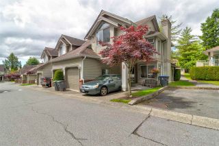 Photo 1: 413 13900 HYLAND Road in Surrey: East Newton Townhouse for sale in "Hyland Grove" : MLS®# R2589774