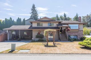 Photo 1: 19700 50A Avenue in Langley: Langley City House for sale : MLS®# R2718431