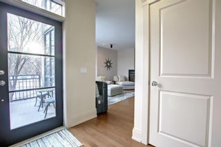 Photo 2: 703 5A Street NW in Calgary: Sunnyside Semi Detached (Half Duplex) for sale : MLS®# A1245061