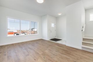 Photo 2: 7569 202 Avenue SE in Calgary: C-390 Semi Detached (Half Duplex) for sale : MLS®# A2045072