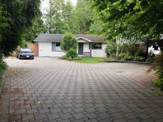 Photo 1: 4930 200 Street in Langley: Langley City House for sale : MLS®# R2591666