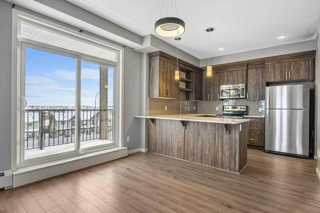 Main Photo: 412 6703 New Brighton Avenue SE in Calgary: New Brighton Apartment for sale : MLS®# A2102523