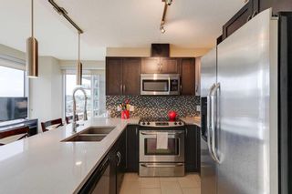 Main Photo: 402 1320 1 Street SE in Calgary: Beltline Apartment for sale : MLS®# A2136113