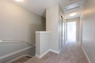 Photo 19: 121 301 REDSTONE Boulevard in Calgary: Redstone Row/Townhouse for sale : MLS®# A1246267