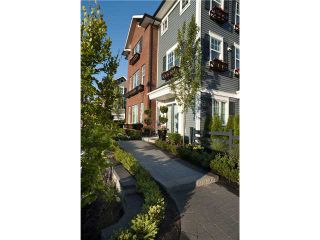 Photo 1: #118 3010 Riverbend Drive in Coquitlam: Coquitlam East Townhouse for sale : MLS®# V863754