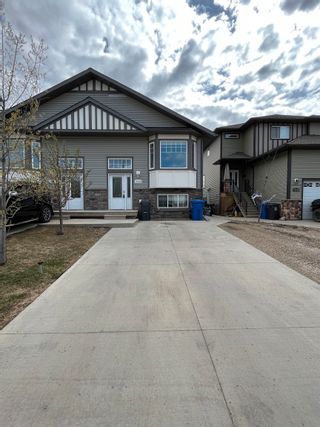 Photo 1: 11013 104A Avenue in Fort St. John: Fort St. John - City NW 1/2 Duplex for sale : MLS®# R2692727