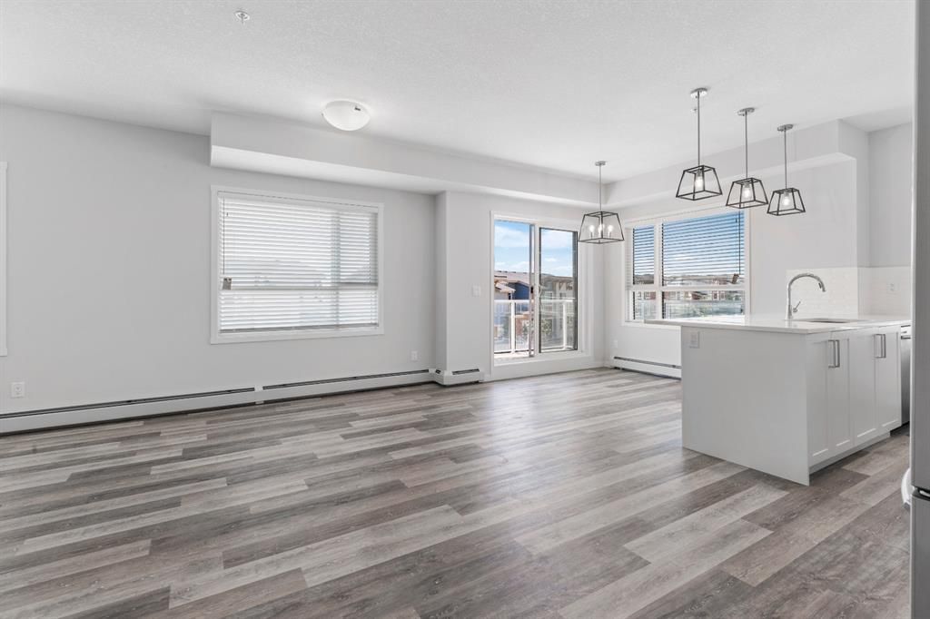 Photo 1: Photos: 309 300 Harvest Hills Place NE in Calgary: Harvest Hills Apartment for sale : MLS®# A1123007