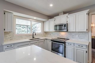 Photo 11: 884 Coach Side Crescent SW in Calgary: Coach Hill Detached for sale : MLS®# A1105957