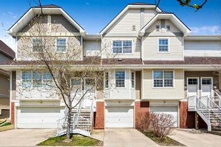 Photo 1: 103 Tuscany Springs Gardens NW in Calgary: Tuscany Row/Townhouse for sale : MLS®# A2129960