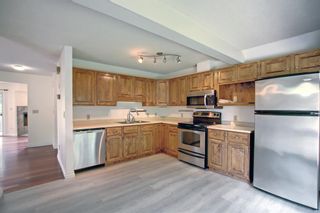 Photo 9: 130 Strathlorne Mews SW in Calgary: Strathcona Park Row/Townhouse for sale : MLS®# A1252004