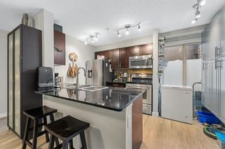 Photo 2: 4102 403 Mackenzie Way SW: Airdrie Apartment for sale : MLS®# A2074395