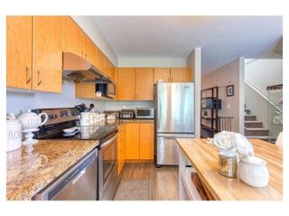 Photo 1: 5 1268 RIVERSIDE Drive in Port Coquitlam: Riverwood Townhouse for sale : MLS®# R2430474