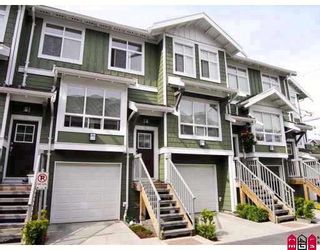 Photo 1: 104 15168 36TH Avenue in Surrey: Morgan Creek Townhouse for sale in "SOLAY" (South Surrey White Rock)  : MLS®# F2910020