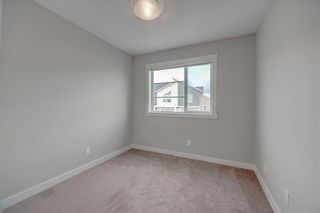 Photo 17: 405 Redstone View NE in Calgary: Redstone Row/Townhouse for sale : MLS®# A1224923