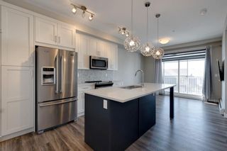 Photo 1: 310 100 Auburn Meadows Common SE in Calgary: Auburn Bay Apartment for sale : MLS®# A2002985