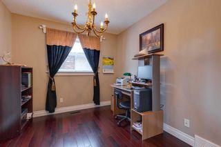 Photo 5: 7059 Christie Briar Manor SW in Calgary: Christie Park Detached for sale : MLS®# A2100773
