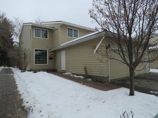 Photo 1: 373 Point Mckay Gardens NW in Calgary: Point McKay Row/Townhouse for sale : MLS®# A1063969