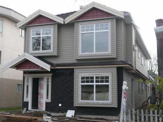 Photo 1: 450 E 44TH Avenue in Vancouver: Fraser VE 1/2 Duplex for sale (Vancouver East)  : MLS®# V681157