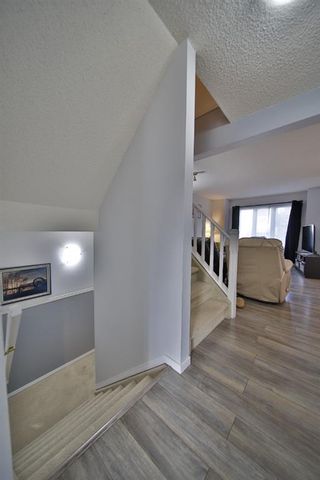 Photo 15: 10 388 Sandarac Drive NW in Calgary: Sandstone Valley Row/Townhouse for sale : MLS®# A1181075