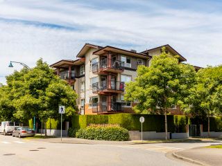 Photo 1: 408 200 KLAHANIE Drive in Port Moody: Port Moody Centre Condo for sale in "Salal" : MLS®# R2603495