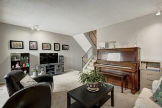 Photo 4: 143 Woodvale Bay SW in Calgary: Woodlands Row/Townhouse for sale : MLS®# A2022754