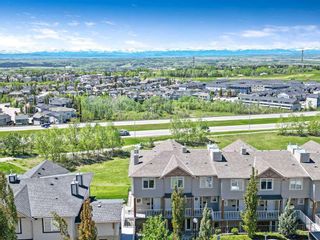 Photo 1: 9 145 Rockyledge View NW in Calgary: Rocky Ridge Row/Townhouse for sale : MLS®# A2138907