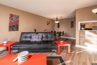 Photo 7: 103 55 Arbour Grove Close NW in Calgary: Arbour Lake Apartment for sale : MLS®# A2029692