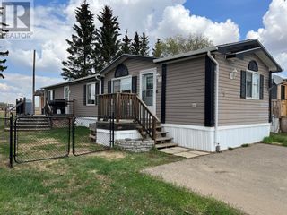Photo 1: 25, 1609 14 Street in Wainwright: House for sale : MLS®# A2048616