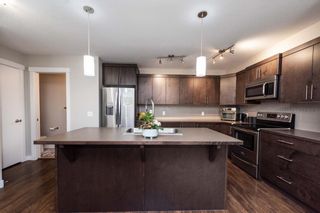 Photo 7: 417 Redstone View NE in Calgary: Redstone Row/Townhouse for sale : MLS®# A2130027