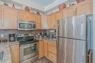 Photo 3: 405 201 Sunset Drive: Cochrane Apartment for sale : MLS®# A2029088