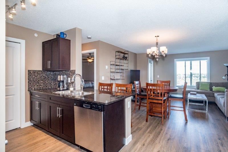 Main Photo: 6407 403 Mackenzie Way SW: Airdrie Apartment for sale : MLS®# A2049267