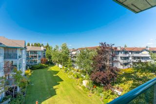 Photo 29: 403 20443 53 Avenue in Langley: Langley City Condo for sale in "COUNTRYSIDE ESTATES" : MLS®# R2717128