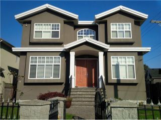 Photo 1: 1591 E 59TH Avenue in Vancouver: Fraserview VE House for sale (Vancouver East)  : MLS®# V1031963
