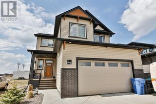 Photo 1: 11 Canyon Meadows Bend W in Lethbridge: House for sale : MLS®# A2076078