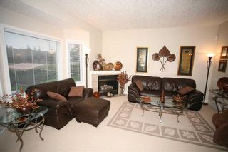 Photo 3: 8 Prominence Park SW in Calgary: Patterson Semi Detached (Half Duplex) for sale : MLS®# A2126879