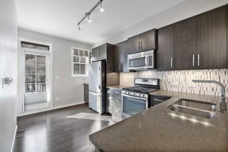 Photo 2: 422 Ascot Circle SW in Calgary: Aspen Woods Row/Townhouse for sale : MLS®# A2124420