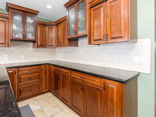 Photo 11: 411 Wilkinson Place SE in Calgary: Willow Park Detached for sale : MLS®# A2096753