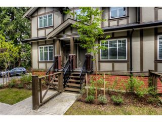 Photo 1: 125 3333 DEWDNEY TRUNK Road in Port Moody: Port Moody Centre Townhouse for sale : MLS®# V1037000