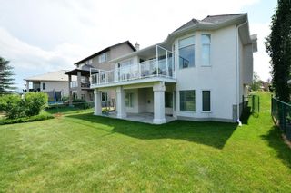 Photo 50: 104 GLENEAGLES Landing: Cochrane House for sale : MLS®# C4127159