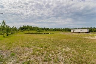 Photo 1: 247569 222 Highway in Gimli Rm: Vacant Land for sale : MLS®# 202312855