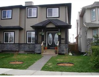 Photo 1: 507 17 Avenue NW in Calgary: Mount Pleasant Semi Detached (Half Duplex) for sale : MLS®# A2122885