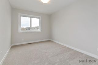 Photo 32: 948 Crestridge Common SW in Calgary: Crestmont Row/Townhouse for sale : MLS®# A2012906