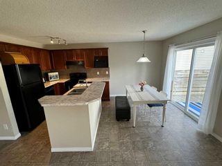 Photo 5: 109 Cougar Plateau Mews SW in Calgary: Cougar Ridge Detached for sale : MLS®# A2144962