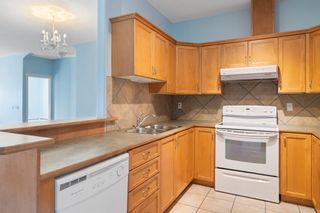 Photo 12: 319 248 Sunterra Ridge Place: Cochrane Apartment for sale : MLS®# A2004149