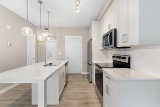 Photo 2: 103 25 Walgrove Walk SE in Calgary: Walden Apartment for sale : MLS®# A2115872